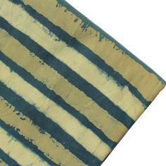 a piece of cloth that has been painted with blue and yellow stripes