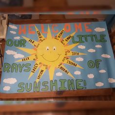 a welcome sign with the words rays of sunshine on it