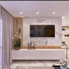 a large flat screen tv mounted to the side of a wall in a living room