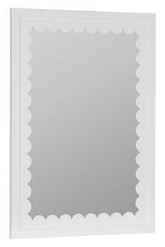 a white framed mirror with scalloped edges