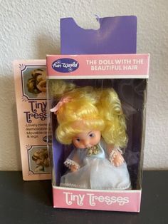 the doll with the beautiful hair is in its box and it's packaged for sale