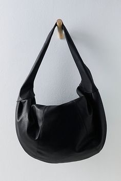 Carry it all in this so cool bag featured in a slouchy, crescent-style silhouette and stunning vegan leather fabrication to add a luxe touch to any look. **Features:** Oversized design, crescent style, vegan leather fabrication, fully lined interior, zip top closure, interior pocket **Why We ❤ It:** Just as cool as it is classic, this goes-with-anything bag is sure to be a staple in your accessories collection for many years to come. | Slouchy Carryall Bag by FP Collection at Free People in Blac Black Slouchy Bag, Crescent Shoulder Bag, Slouchy Shoulder Bag, Free People Bag, Leather Slouch Bag, Black Hobo Bag, Daily Fits, Slouchy Hobo Bag, Leather Bag Design