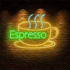 a neon sign that says espresso on it in front of a brick wall