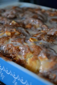 a close up of a cake in a box with icing on it's surface