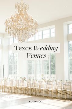 a wedding venue with chandelier and tables