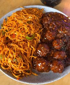 a plate with spaghetti and meatballs on it