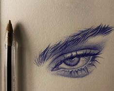 a pencil drawing of an eye with long lashes and blue eyeshade on paper