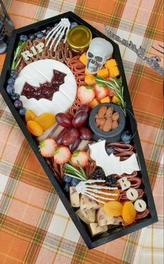 an elaborate halloween platter is displayed on a table