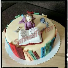 a cake with an open book on top of it