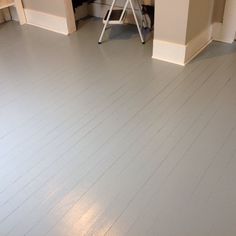 an empty room with hard wood flooring and white paint on the walls is shown