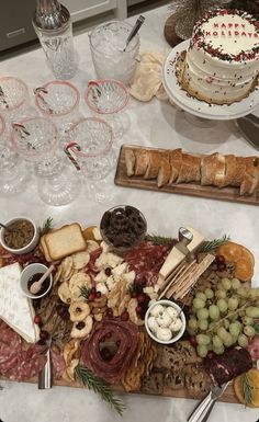 a platter filled with meats, cheeses and crackers on top of a table