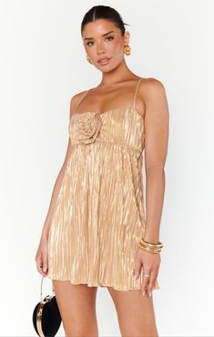 Slip into something shimmery for your next night out with the girls! The GNO Mini Dress features shiny gold fabric and an adorable rosette at the front, perfect for making a statement in any room you walk into. Pair it with white strappy heels and a chic handbag to complete the look! White Strappy Heels, Cami Nyc, Pleated Mini Dress, Pleated Fabric, Solid & Striped, Show Me Your Mumu, Trina Turk, Show Me Your, Gold Dress