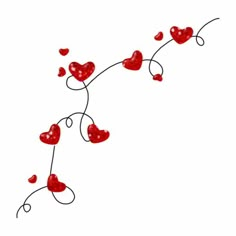 some red hearts are hanging from a wire