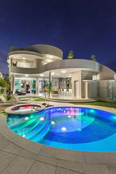 a house with a swimming pool in front of it