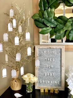 there is a tree that has been placed on the table with baby's breath written on it