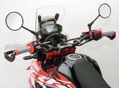 the handlebars and mirrors on a motorcycle are clearly visible for us to see