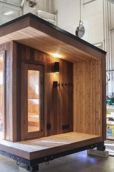 a wooden sauna in the middle of a building