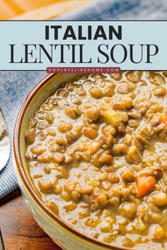 a bowl filled with lentil soup on top of a wooden table