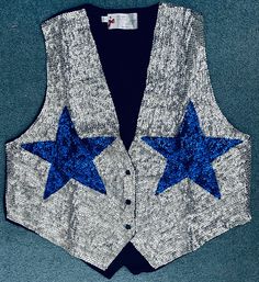 This vintage Sequined Vest has a silver background with two large blue stars. The front of this handmade vest is covered with high quality sequins, and the back is 100% black polyester. The last product photo is a size chart for you to determine the best size for your needs. Please note that the size may vary by about 1 inch, give or take. Silver Sequin Vest, White Vest Suit, Silver Vest, Cowboy Vest, Handmade Vest, Sequin Vest, Space Cowboys, Silver Background, Cowboy Party