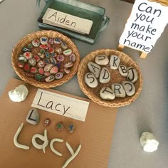 a table topped with lots of different types of buttons and magnets on top of paper