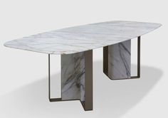 a white marble table with metal legs