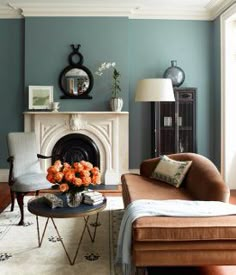 a living room with blue walls and furniture