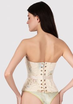 Sunlight Corset is a combination of sophistication and sunny light mood. This corset has a natural push-up effect due to the special arrangement of the bone layout and design. The corset is able to reduce the waist and hips, creating the perfect hourglass silhouette that makes you more feminine. The corset is made of high-quality French satin and transparent net hand-embroidered with sky blue and golden dandelions. It also has transparent paillettes (recycled plastic) imitating the morning dew. Feminine Underbust Corset With Built-in Bra, Spring Beige Corset With Built-in Bra, Feminine Wedding Corset With Built-in Bra, Beige Corset With Built-in Bra For Spring, Beige Sleeveless Corset With Built-in Bra, Fitted Beige Corset Dress, Feminine Corset With Sweetheart Neckline And Fitted Bodice, Elegant Underbust Corset For Spring, Fitted Bandeau Corset With Boned Bodice