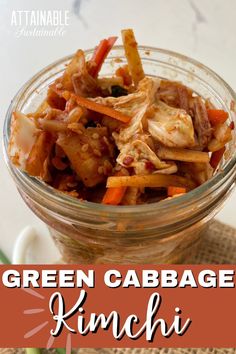 green cabbage kimchi in a glass bowl with chopsticks on the side and text overlay that reads, green cabbage kimchi