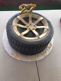 a birthday cake made to look like a tire