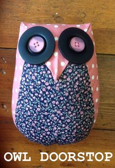 an owl door stop with two buttons on it's eyes and the words owl doorstop