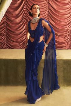 Electric blue pre-draped ruffle saree with tonal sequin-bead embellished borders. Comes with floral bead embroidered cut-out blouse. - Aza Fashions Floor-length Ruffled Blouse Piece For Party, Blue Draped Blouse Piece For Evening, Glamorous Pre-draped Saree With Ruffles For Reception, Glamorous Ruffled Pre-draped Saree For Reception, Blue Ruffled Pre-draped Saree For Party, Fitted Blue Saree With Ruffles, Blue Embellished Pre-draped Saree, Blue Ruffled Pre-draped Traditional Saree, Fitted Draped Blue Blouse Piece