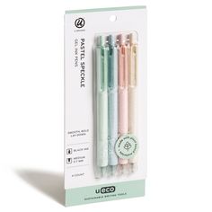 three different colored pens in packaging on a white background