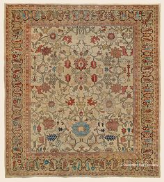 an antique rug with many different designs and colors