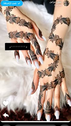 the hands and arms are decorated with henna