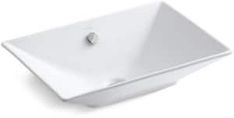 a white square sink sitting on top of a counter