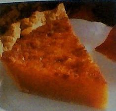 a piece of pie sitting on top of a white plate