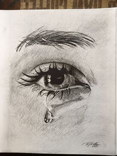 a pencil drawing of an eye with the tear coming out of it's iris