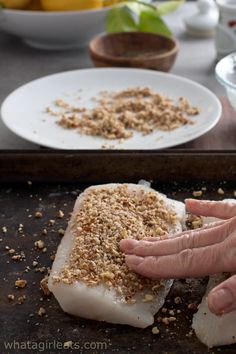 a person is peeling food off of a piece of fish