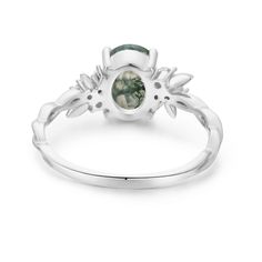 Magical, otherworldly, enchanting. Our Enchanted Garden Moss Agate Ring© has earned its name with a stunning oval-cut moss agate center stone adorned with clusters of round white topaz gems in a twisted band. May this piece allow you to spread the seeds of happiness and cultivate a life you love. ✦ Available in both 14K white gold vermeil (14K white gold plated over a sterling silver base) and 10K solid white gold. Oval Moss Agate Gemstone Ring, Nature-inspired Oval Agate Jewelry, Bff Rings, Magical Stones, Moss Agate Ring, Twisted Band, Ring White Gold, Enchanted Garden, Vermeil Jewelry