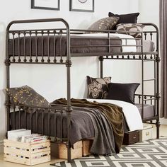 a metal bunk bed sitting on top of a rug