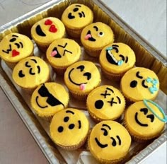 there are many cupcakes with different faces on them