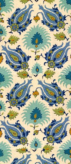 a blue and green floral pattern on fabric