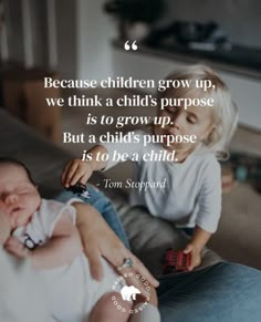 a woman holding a baby while sitting on top of a bed with a quote from tom shepard