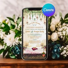 an iphone with the wedding program displayed on it next to flowers and greenery in front of a white wall