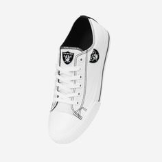 Low tops. High spirits. No matter the final score, you'll always be winning with the Las Vegas Raiders Women's Big Logo Low Top White Canvas Shoes on your feet. Features All-over white design so you can rep the team in style Team logo displays on tongues, in case there were any doubts where your allegiances lie Bold team logo displays on outer sides for a little extra team spirit Team-colored stripe accents on midsoles and heels for added fan fashion Adjustable laces for security Closed, round t White Sporty Basketball Shoes With Vulcanized Sole, Sporty White Basketball Shoes With Vulcanized Sole, White Sneakers With Logo Print For Sports, White Sporty Skate Shoes With Logo Print, High-top White Sneakers For Sports Events, White High-top Custom Fade-resistant Sneakers, Casual White Custom Sneakers With Logo Print, White High-top Sneakers For Sports Events, White Sneakers With Team Spirit