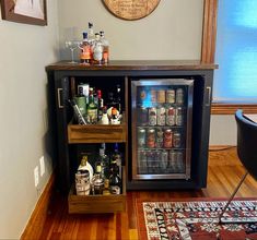 a mini fridge is open and filled with drinks