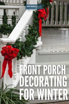 front porch decorating for winter with red bows and greenery on the banister