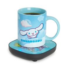 a blue coffee mug sitting on top of a coaster