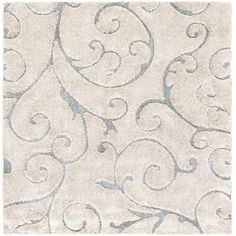 a white rug with grey swirls on it