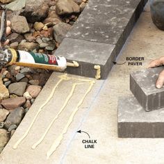 someone is pouring cement onto the ground to build a garden bench with concrete blocks and glue